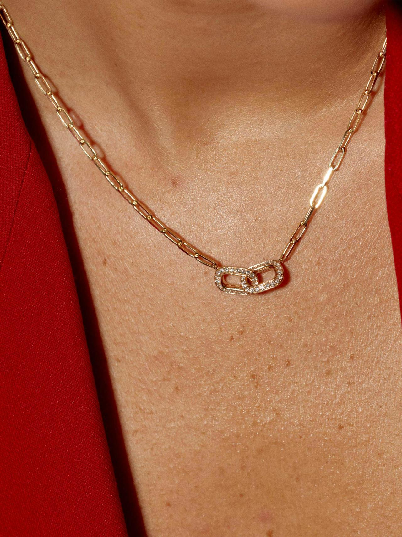 A succession of 18k polished gold chains are connected together to meet two bold brushed gold links in the middle, holding 42 brilliant lab-created diamonds with a total of 0.63ct.