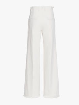 The Ruth wide leg jeans sit high on the waist, finished in crisp white denim with a frayed edge detailing at the waist and hem.
