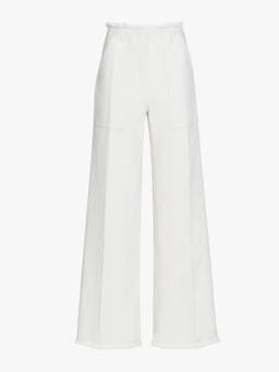 The Ruth wide leg jeans sit high on the waist, finished in crisp white denim with a frayed edge detailing at the waist and hem.