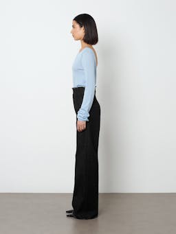 The Ruth jean sits high on the waist, finished in ink black denim with a frayed edge detail at the waist and hem.