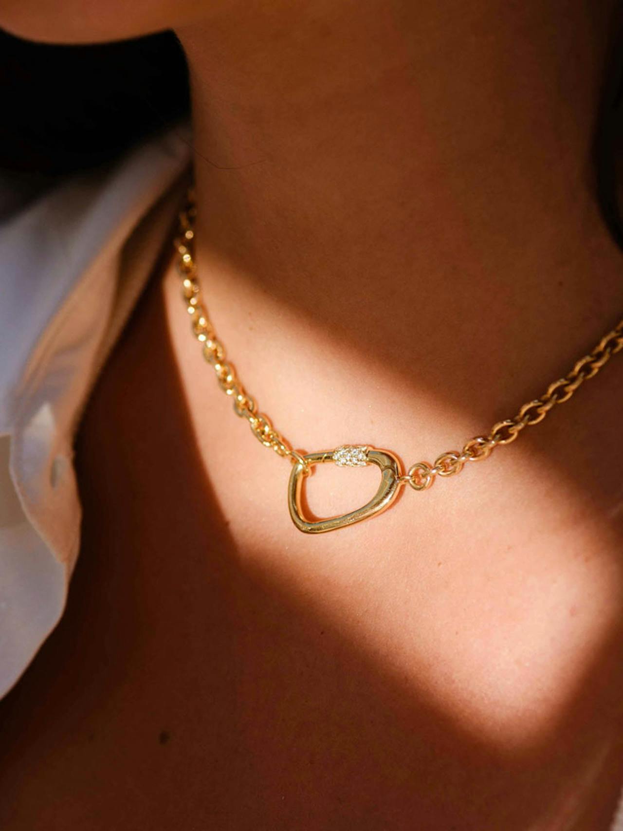 Introducing The Atlas Necklace. Suspended between an 18k recycled gold chain, a bold ornament is inspired by the organic formations of nature.