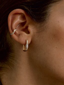 No need for piercings with our statement Double ear cuff. Inspired by the organic forms of nature, this is crafted from recycled 18k gold in an undulating shape.