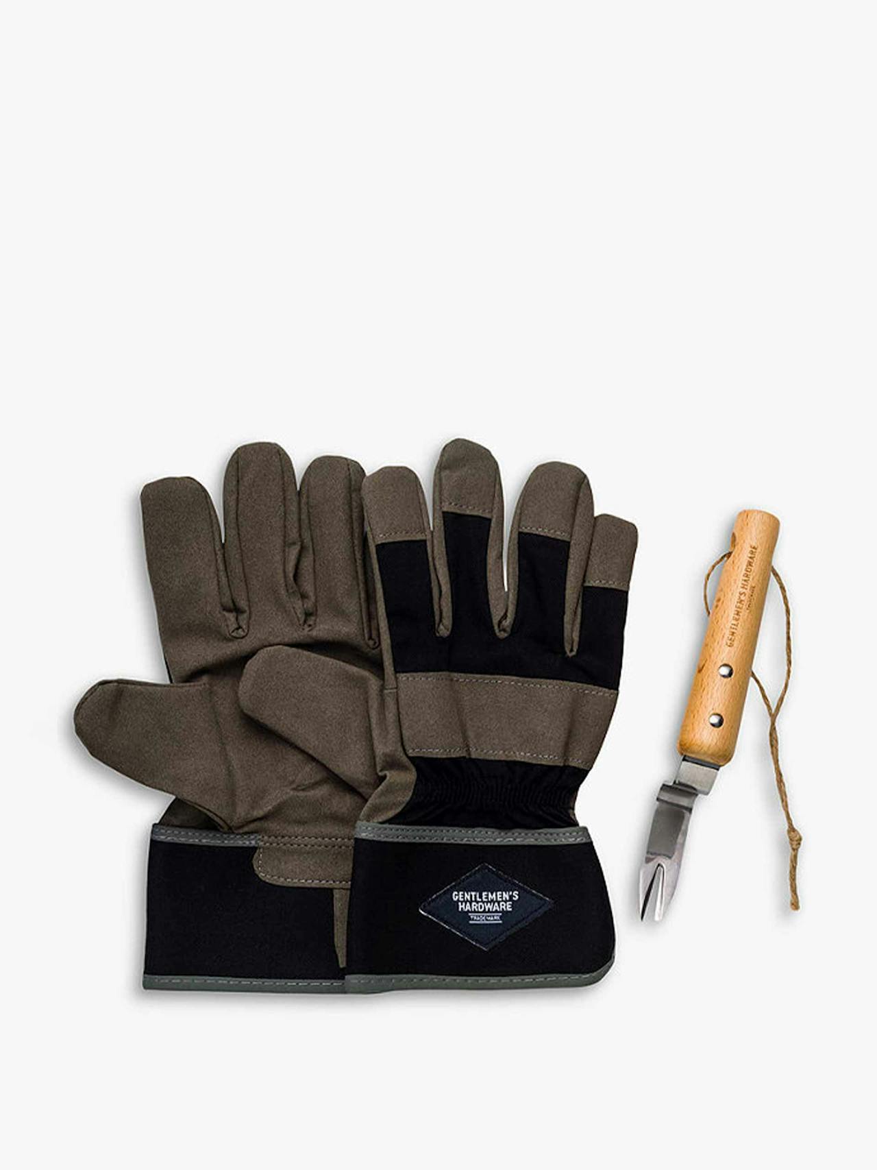Brown gardening gloves and root lifter