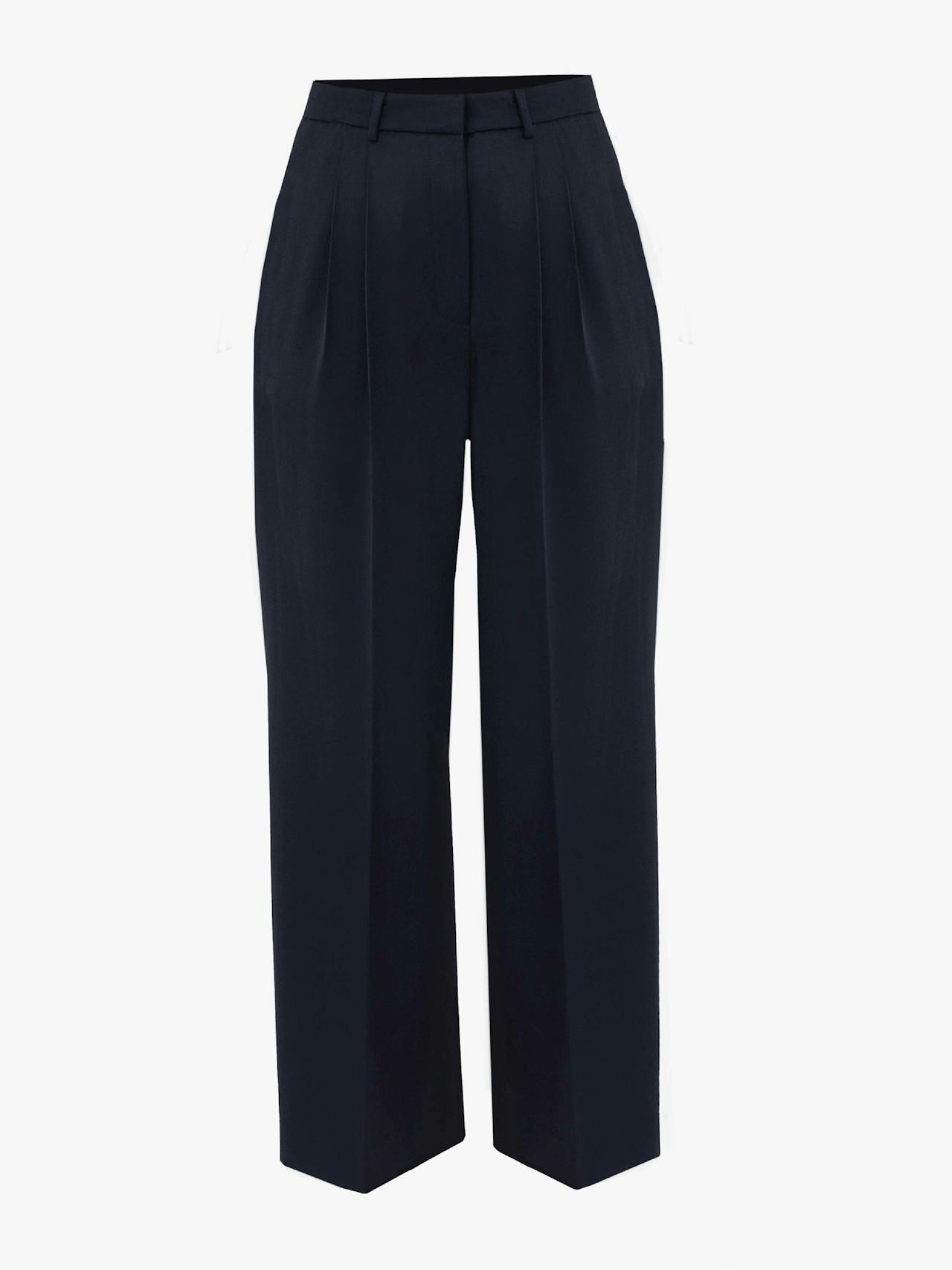 The Stanley navy blue trouser by Issue Twelve sits high on the waist with two pleats running down the full long leg. Perfect for Autumn Winter. Collagerie.com