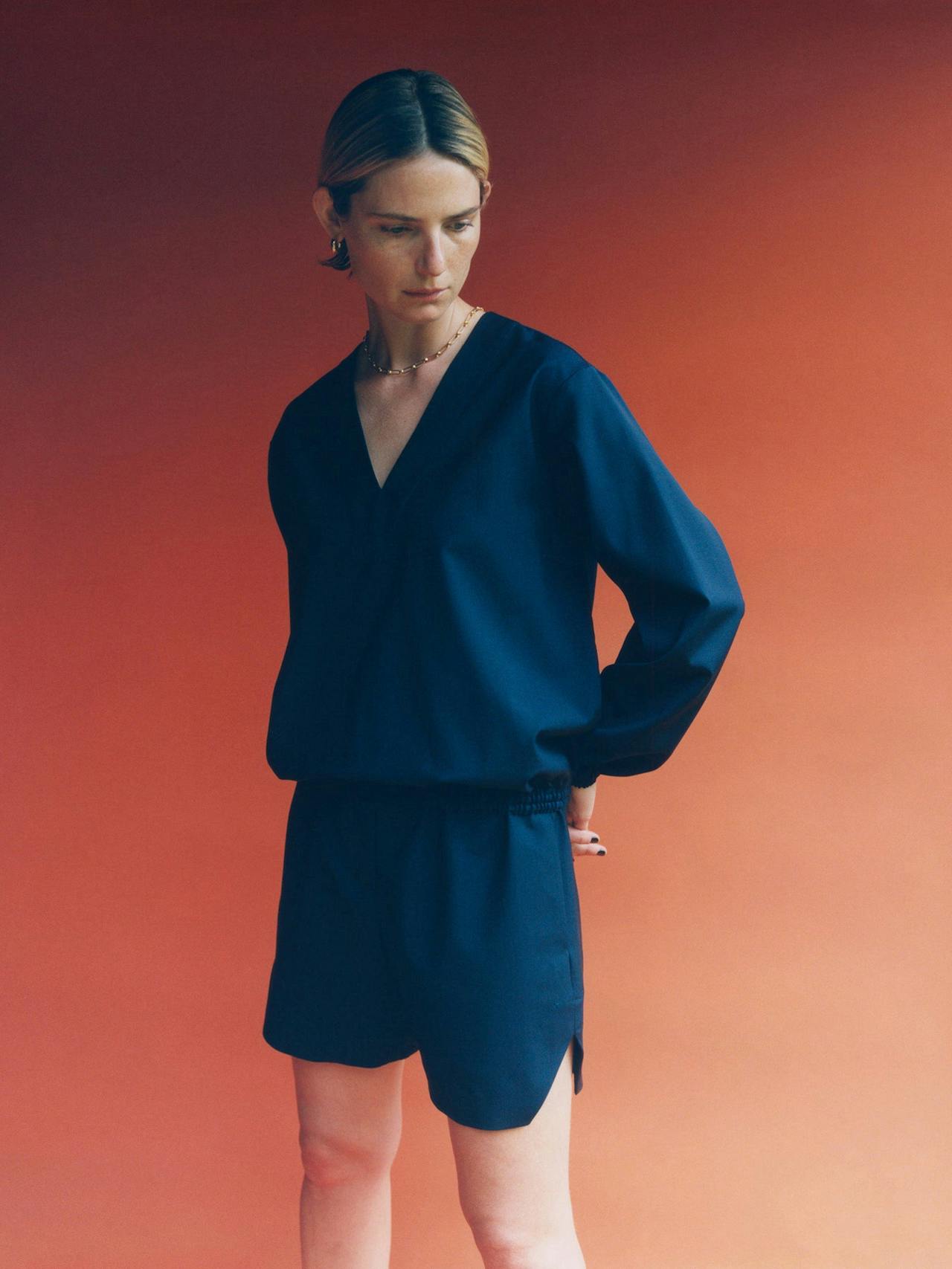 Oversized blue wool sweater by Issue Twelve, with dropped shoulder sleeve and wide v-neck. A perfect addition to the Autumn Winter wardrobe.  Collagerie.com