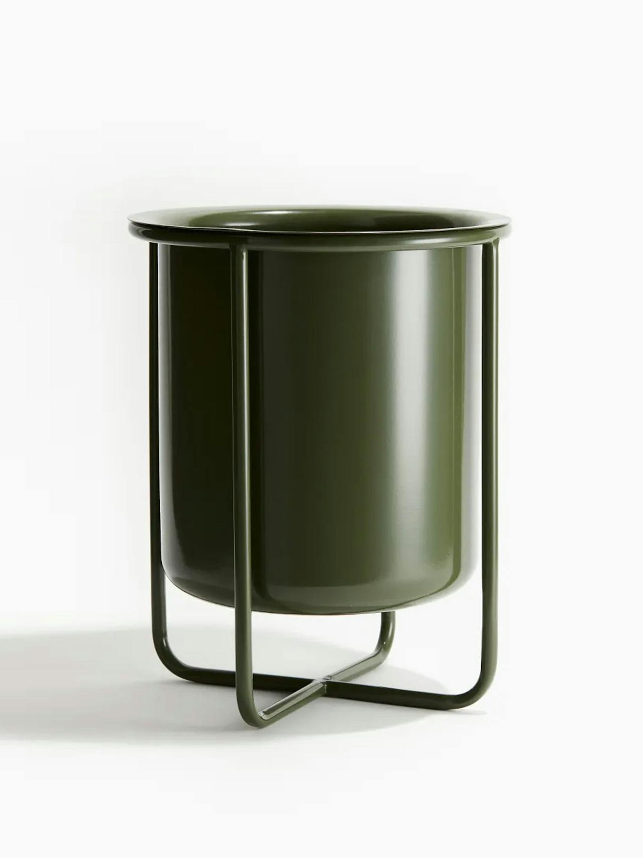 Large metal plant pot on a stand
