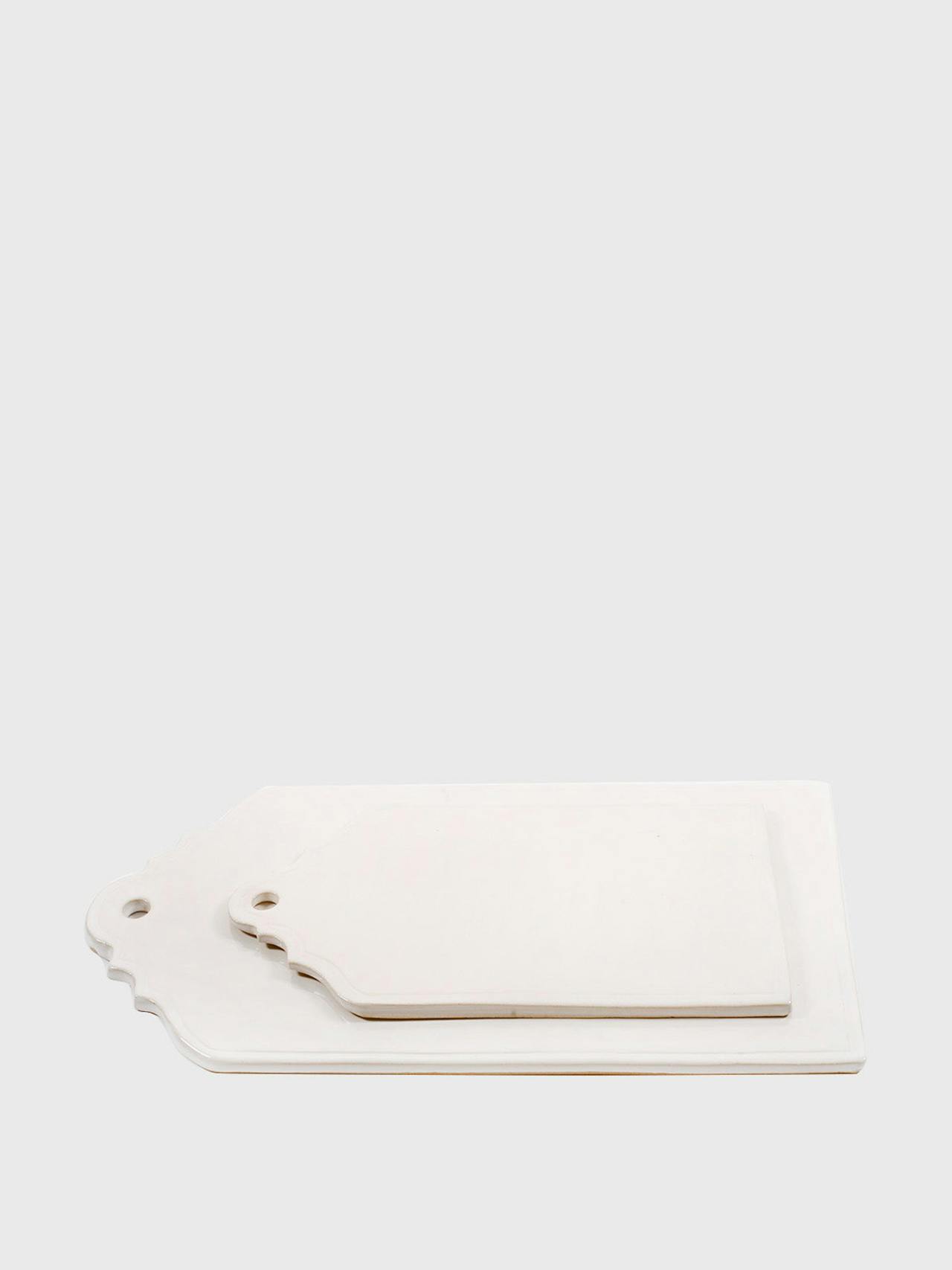 Inspired by the architectural silhouettes of the gables of Montagu, South Africa, these  Hadeda ceramic cheese boards are perfect in their artisan, minimal design. Collagerie.com