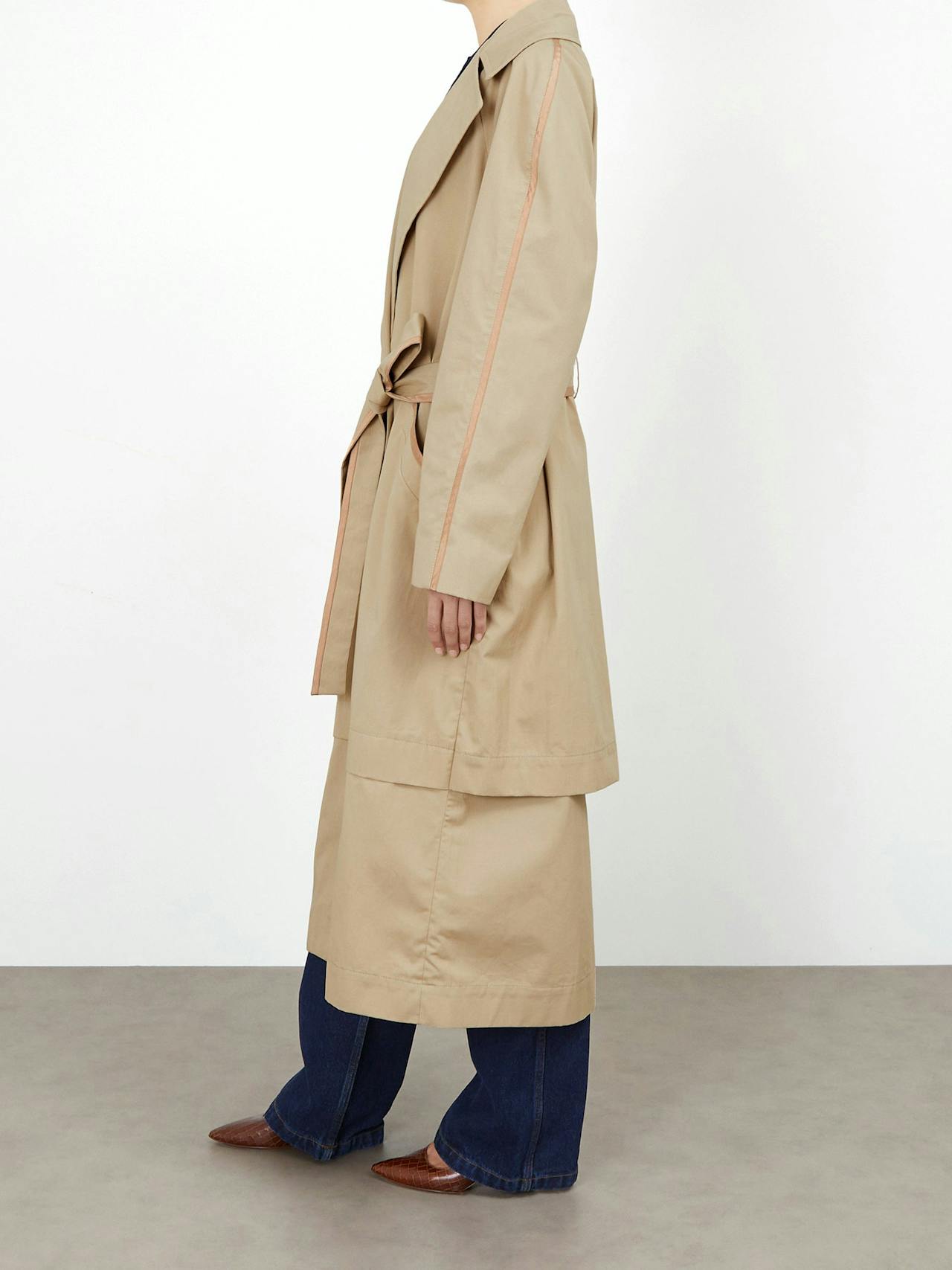This Issue Twelve double-breasted, oversized fit coat is the perfect classic trench for any outfit. Collagerie.com