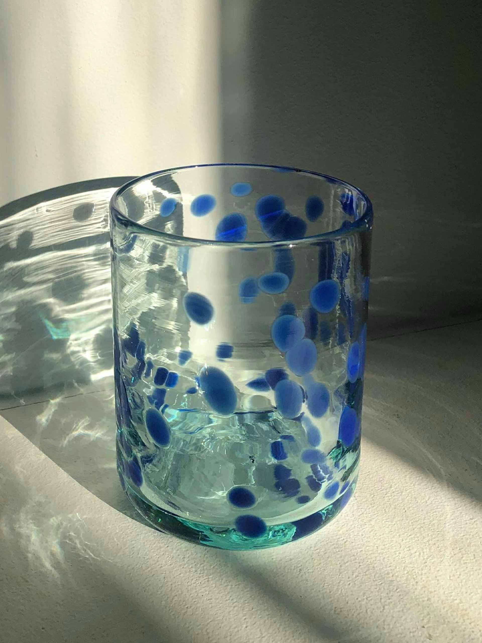 Blue speckled glass tumbler