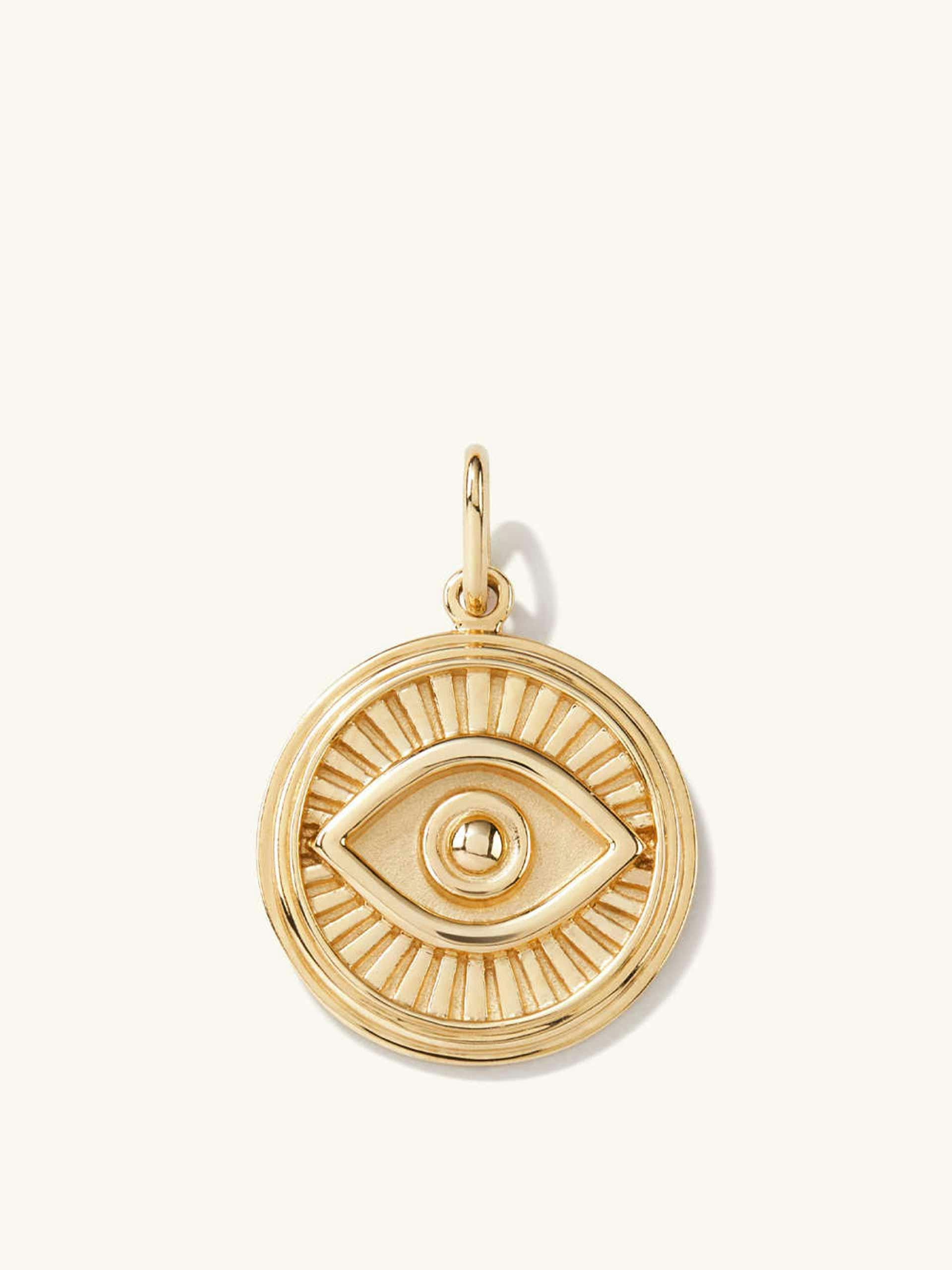 Yellow gold evil eye charm pendant