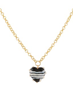 The XL Milagros Heart in black and ivory and gold belcher chain necklace from sandralexandra is made with lampwork glass handmade by local artisans in Barcelona. Collagerie.com