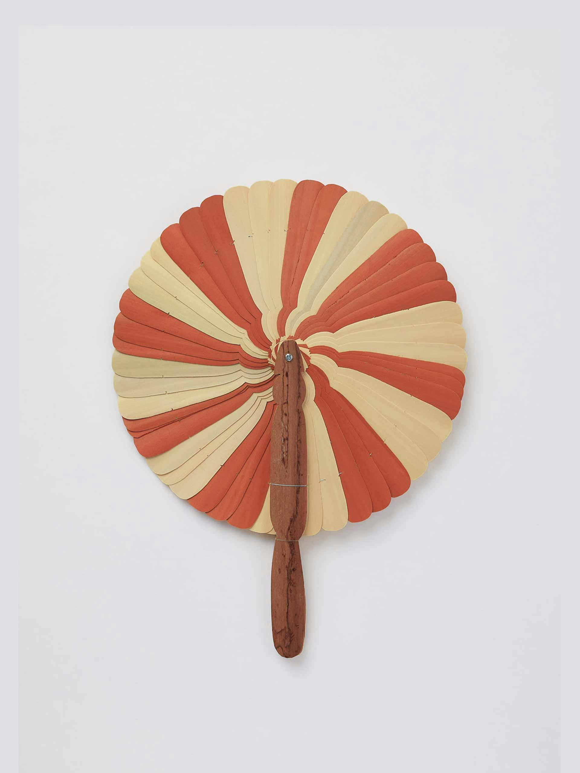 Burnt orange wooden fan