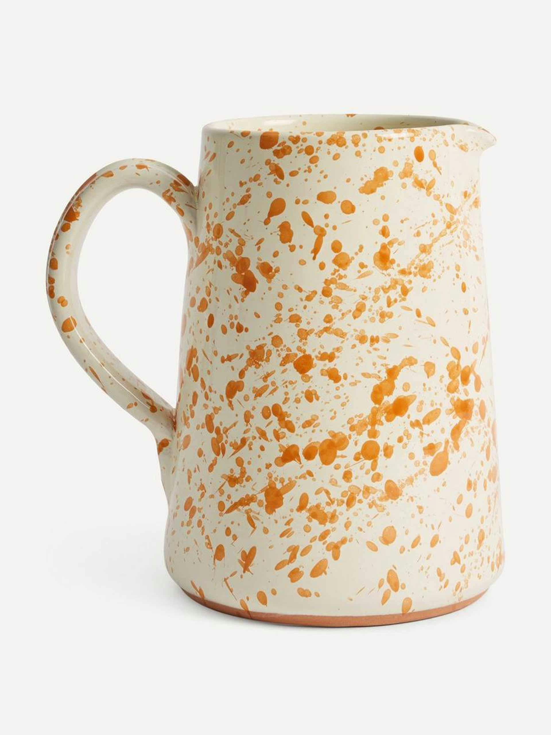 Orange splatter ceramic jug