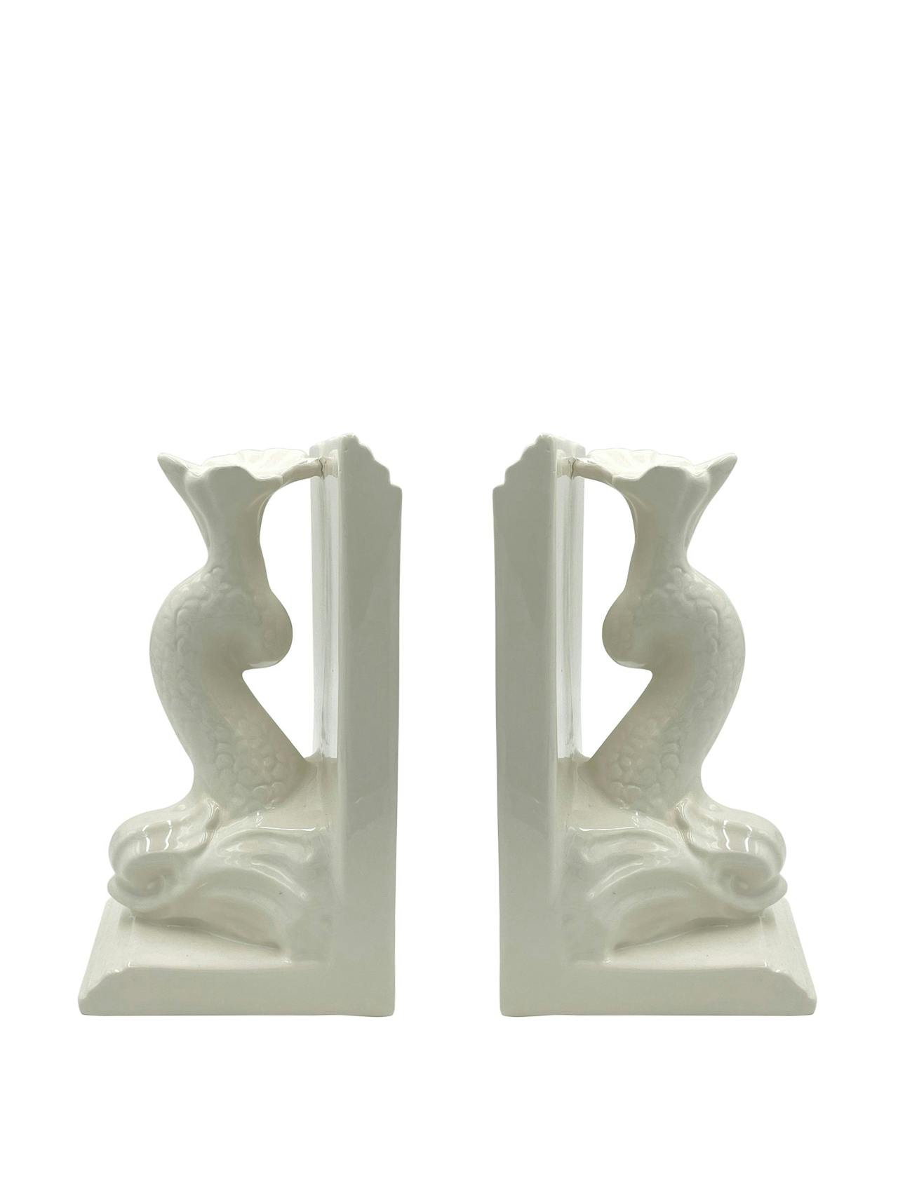 Pair of dolphin bookends in cream