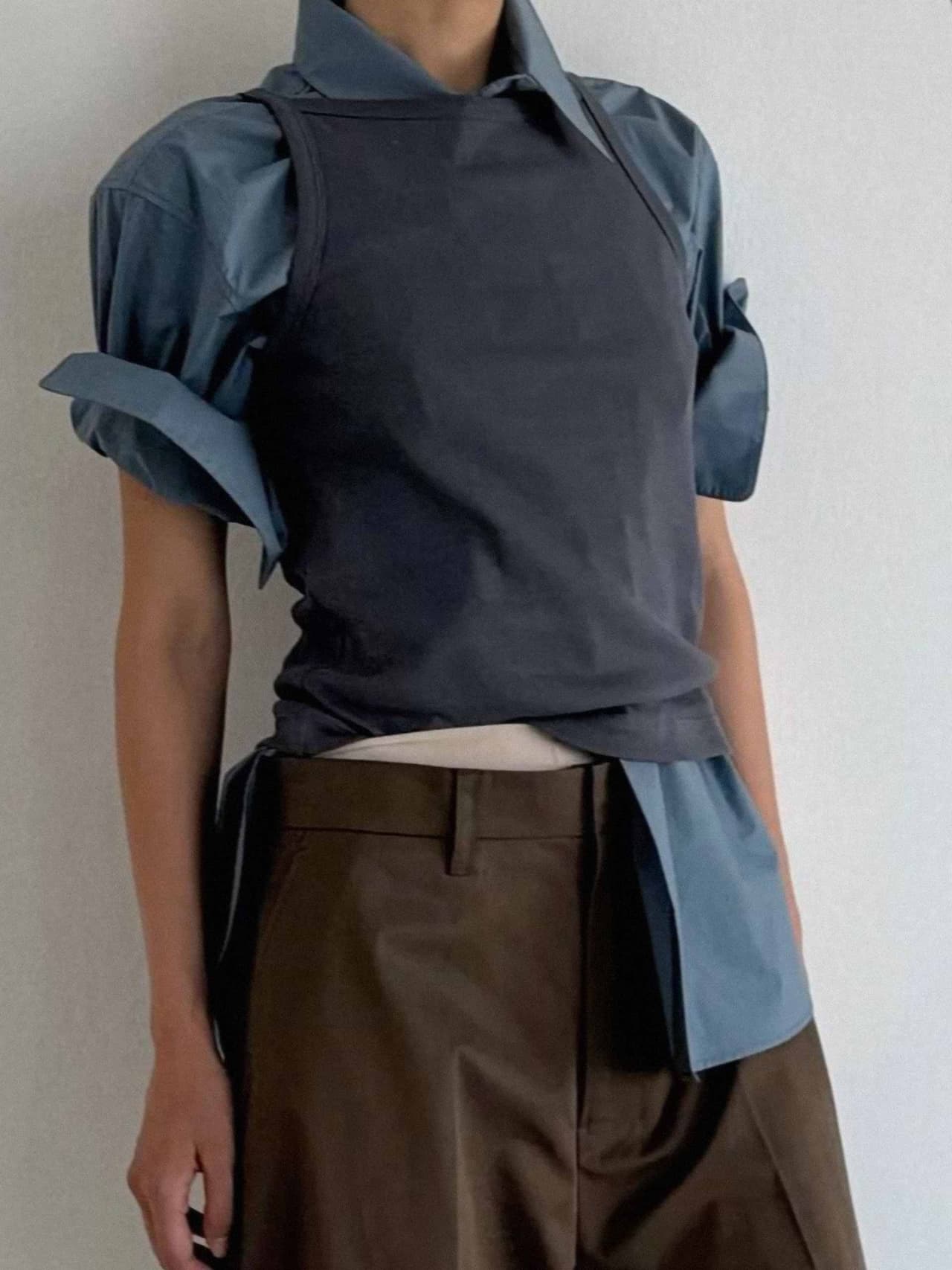 brown-blue-holding-a-personal-uniform