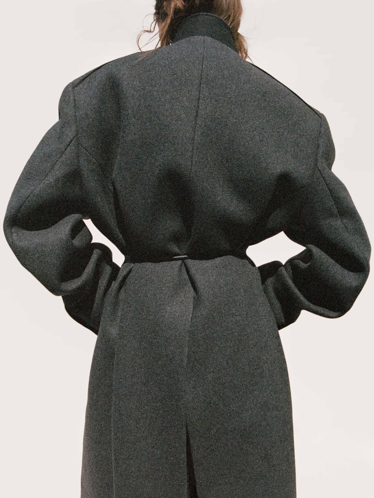 coats-holding-hm-studio